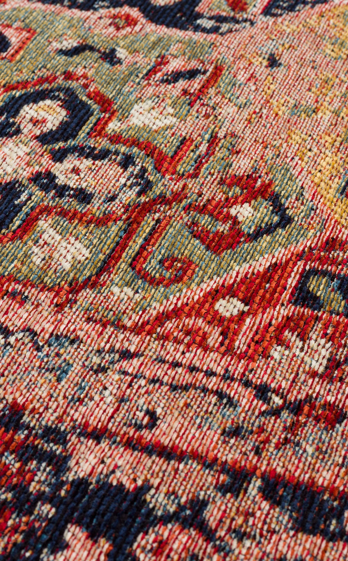 Close-up of the Anatolian Weave - Washable Kilims - AND01 showcases its multicolour design in red, blue, green, and cream. Crafted from soft chenille polyester, this rug combines traditional patterns with lasting beauty and easy maintenance