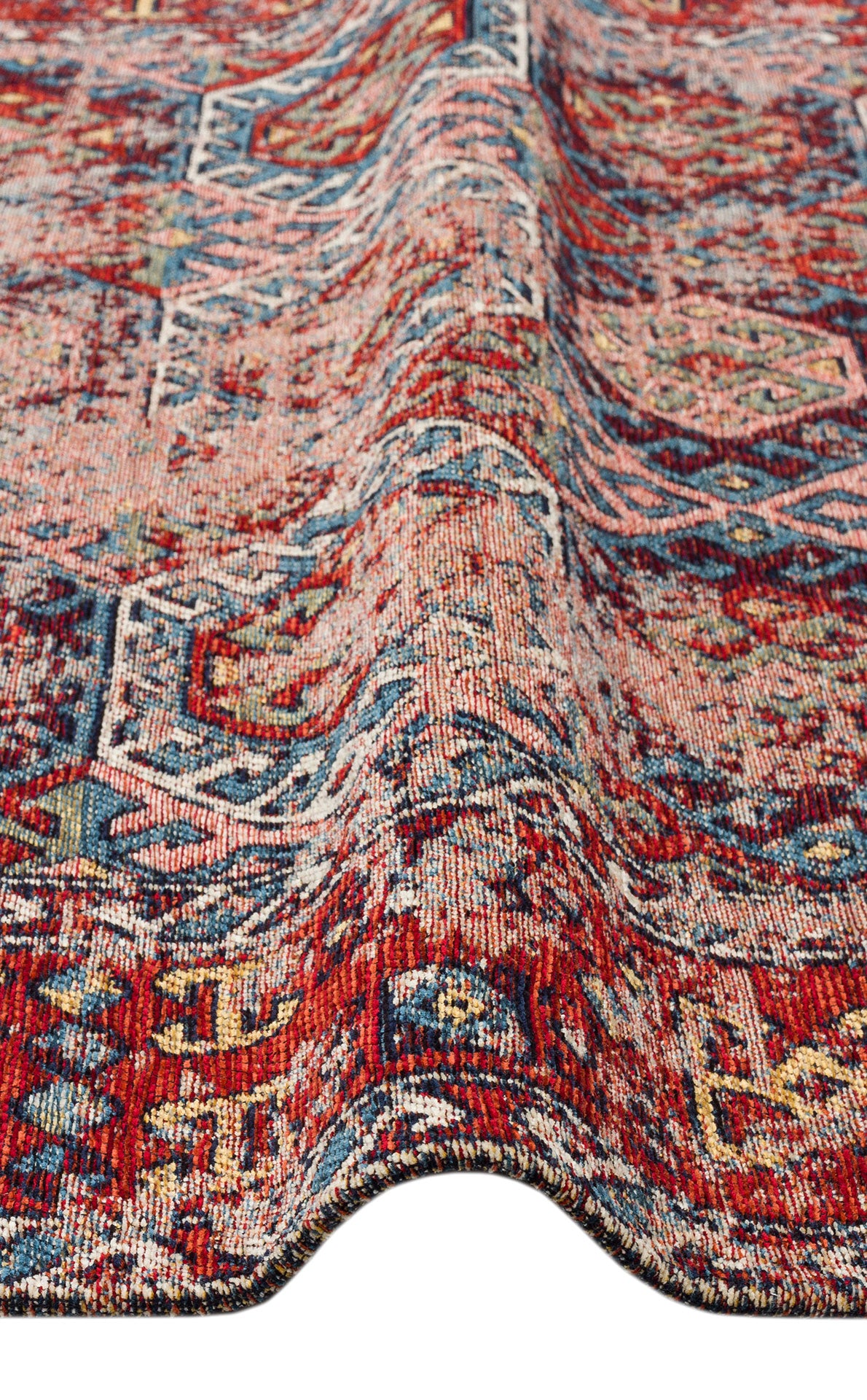 A close-up of the Nomad Spirit - Washable Kilims - AND03 shows its red, blue, and beige tribal patterns with a raised ripple, highlighting the intricate flatwoven texture and weave of this unique rug.