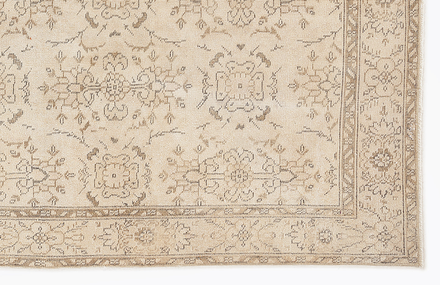 Beige and taupe rug with a traditional floral medallion pattern and a detailed border on a white background.