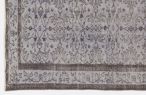 Load image 1 in gallery view. Blue and charcoal grey rug with a distressed traditional medallion pattern and a wide decorative border.