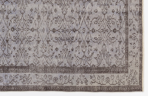 Load image 1 in gallery view. Grey and charcoal rug with a distressed traditional floral medallion pattern and a wide decorative border.