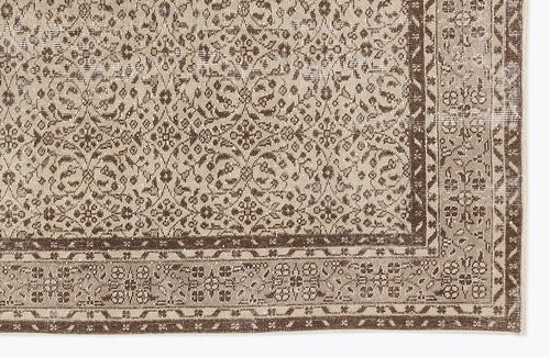 Load image 1 in gallery view. Beige and brown traditional rug with a distressed floral medallion pattern and a detailed geometric border.