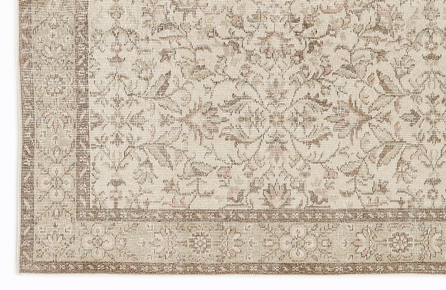 Beige and taupe rug with a traditional floral medallion pattern and a detailed border.