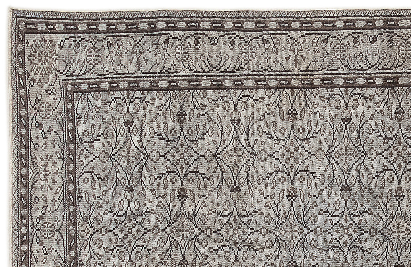 Grey and brown rug with a traditional floral lattice pattern and a detailed geometric border.
