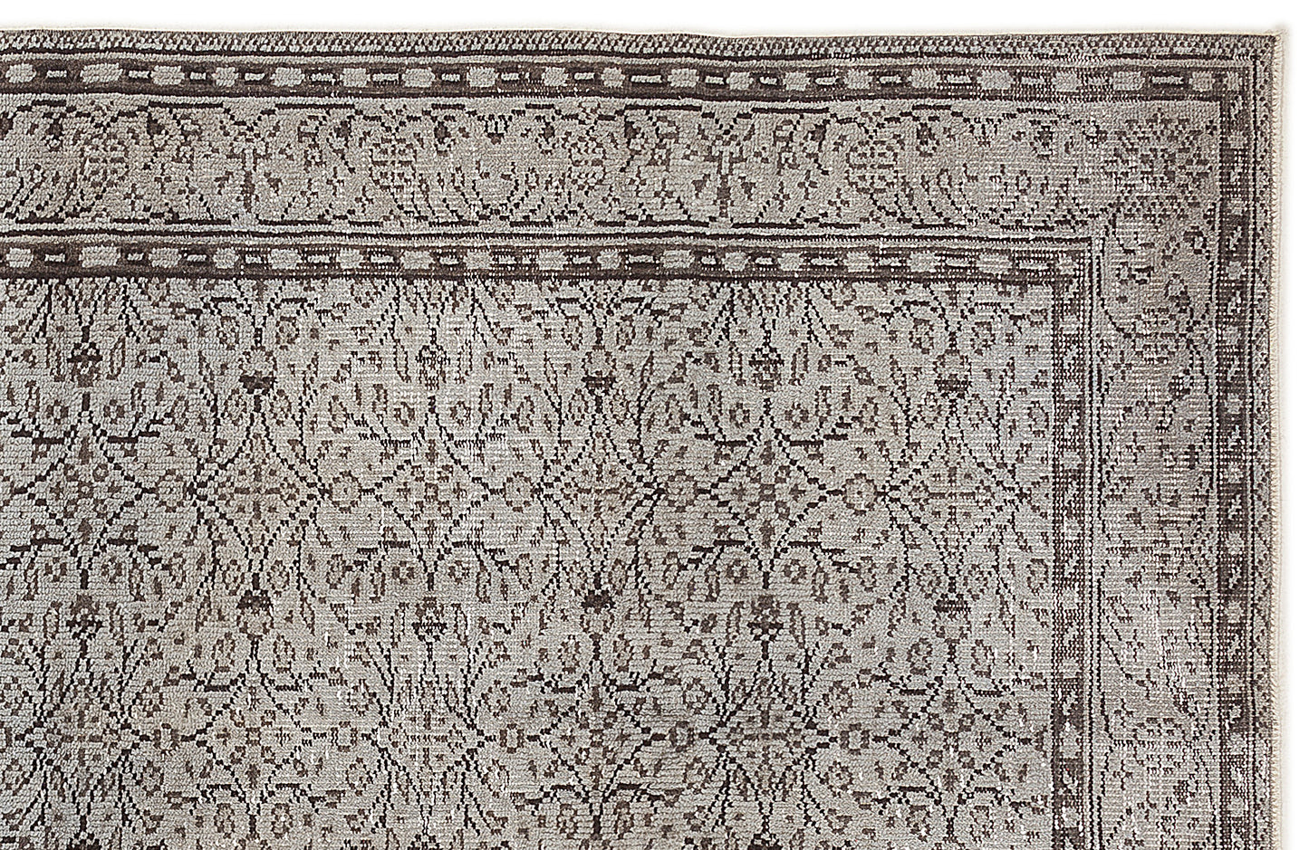 Taupe and charcoal grey rug with a traditional floral medallion pattern and a detailed border.