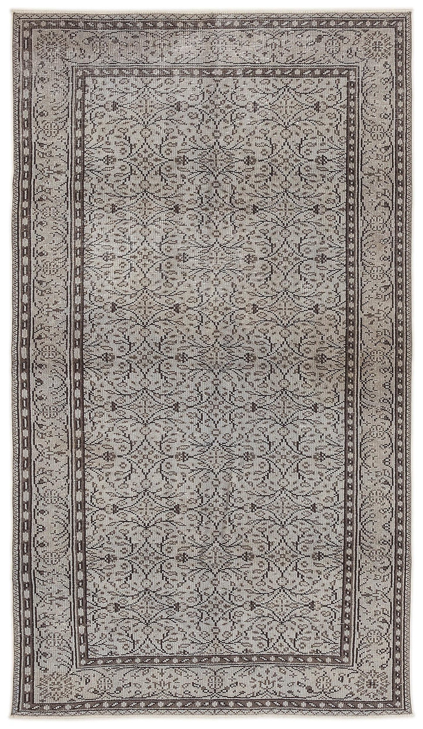 Grey and brown traditional rug with a repeating floral medallion pattern and a decorative border.