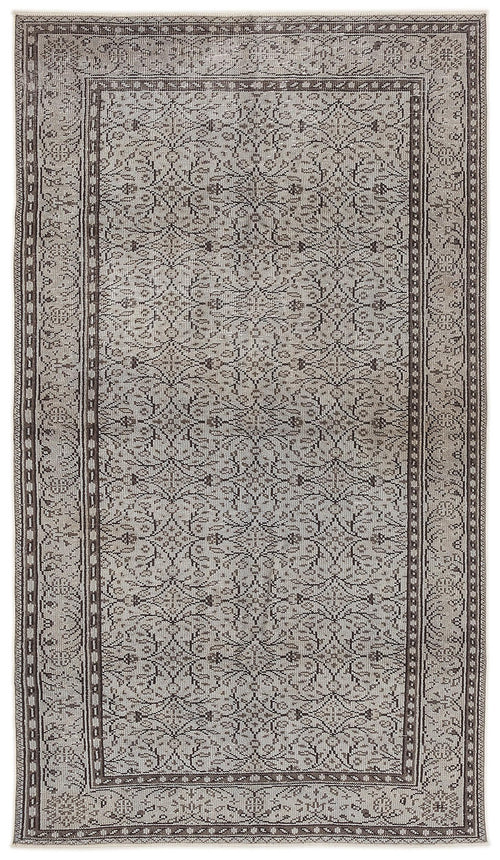 Load image 1 in gallery view. Grey and brown traditional rug with a repeating floral medallion pattern and a decorative border.