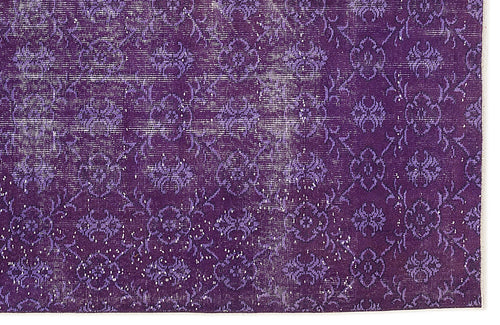 Load image 1 in gallery view. Deep purple vintage-style rug with a distressed floral medallion pattern and white worn accents.