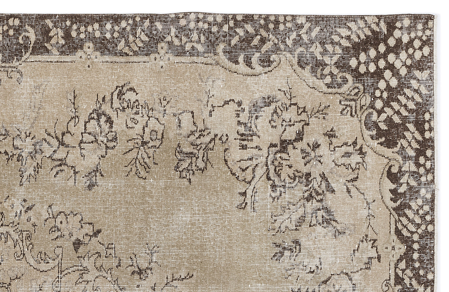 Beige and dark brown vintage-style rug with a distressed floral pattern and a decorative border.