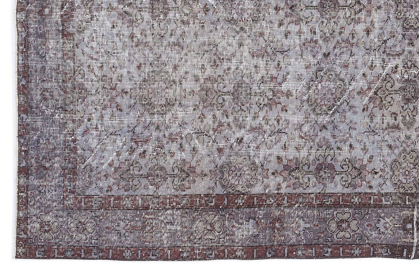 Distressed grey and burgundy rug with a traditional floral medallion pattern and a wide decorative border.