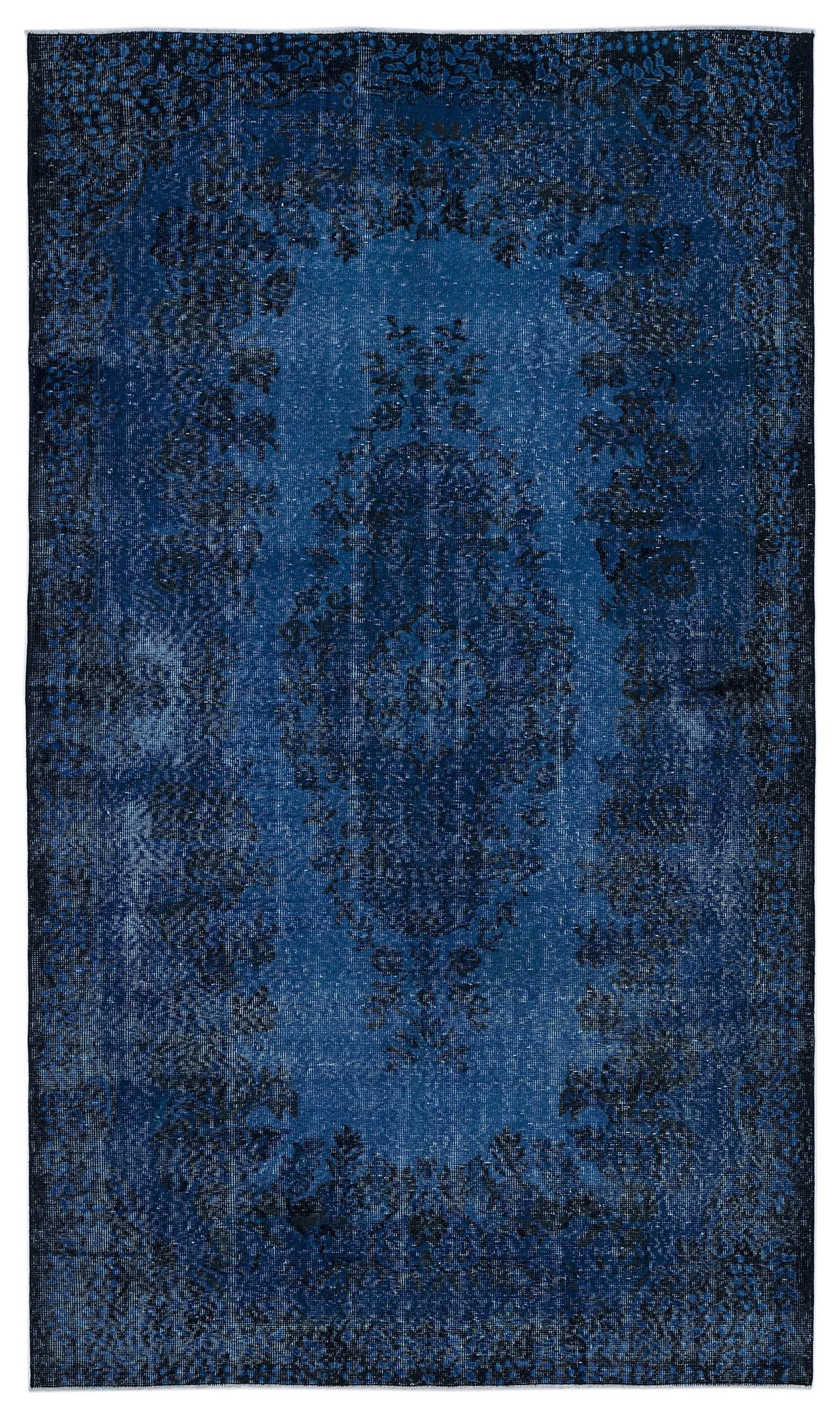 Deep blue distressed rug with a traditional central medallion and ornate floral border.