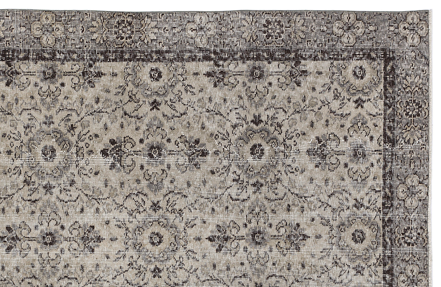 Charcoal and beige traditional rug with a distressed floral medallion pattern and a detailed border.