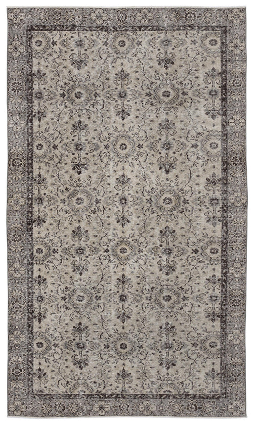 Load image 1 in gallery view. Grey and charcoal distressed rug with a traditional floral medallion pattern and a wide decorative border.