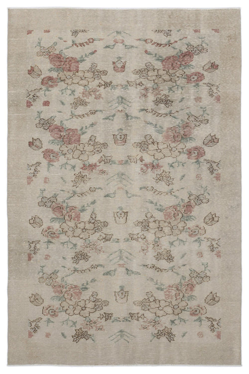 Load image 1 in gallery view. Beige vintage-style rug with a faded floral pattern in muted red, green, and brown tones.