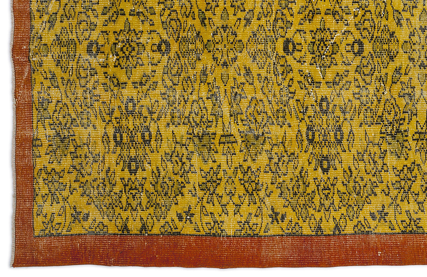 Mustard yellow rug with a black floral medallion pattern and a solid burnt orange border.