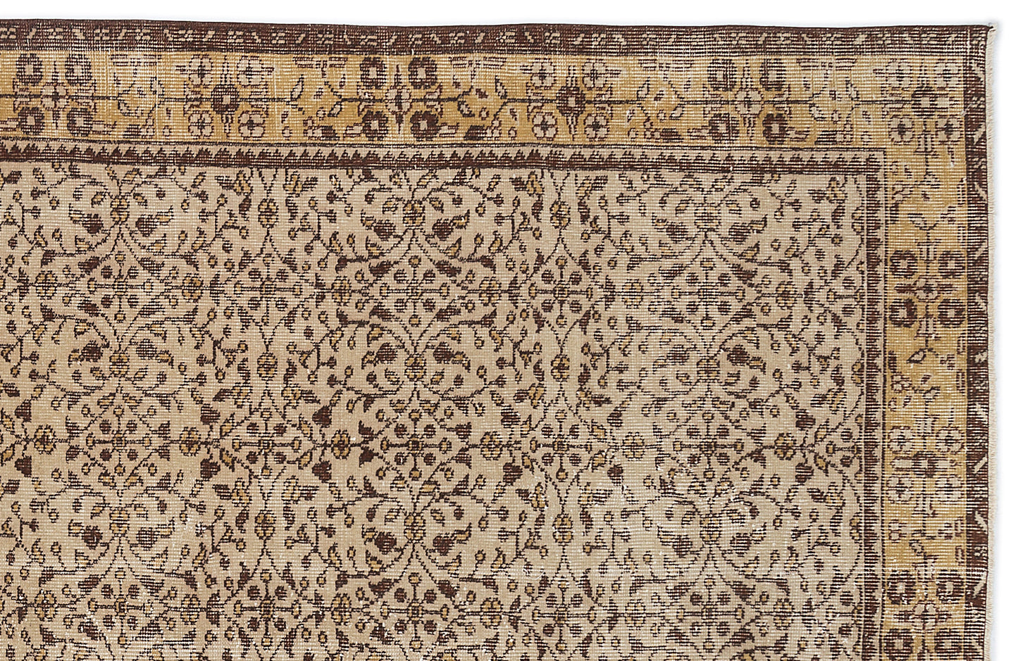 Beige and brown traditional rug with a repeating floral vine pattern and a decorative geometric border.