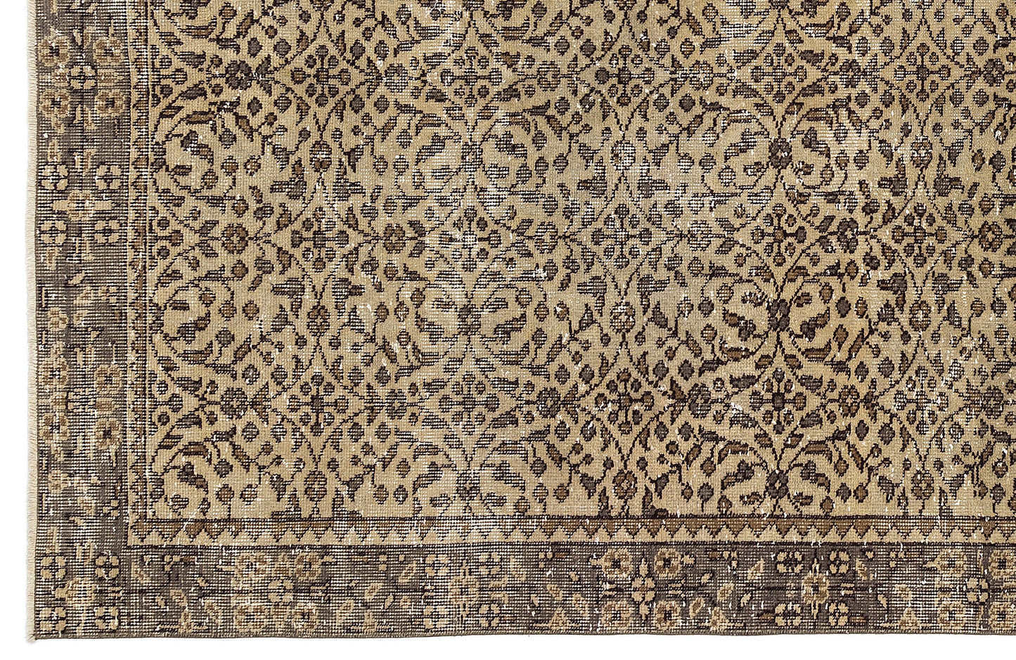 Tan and dark brown rug with a distressed, traditional floral vine pattern and a wide decorative border.