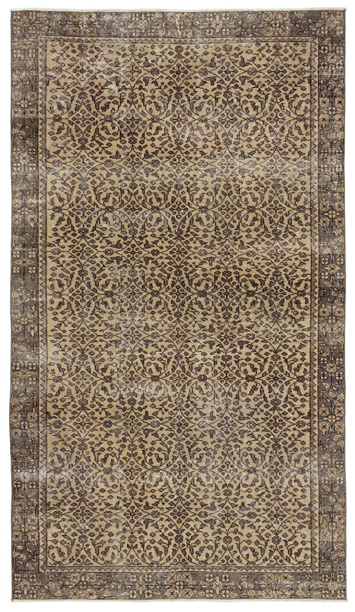 Load image 1 in gallery view. Distressed brown and tan rug with a traditional floral medallion pattern and a wide decorative border.
