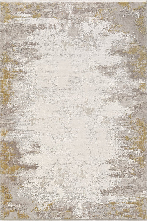 Load image 1 in gallery view. The Abstract Blitz Premium Rug - Gold - M658F is a machine-made, rectangular rug with an abstract design in beige, gray, and gold tones, featuring soft blended patches and a textured, faded-edge look for modern style.