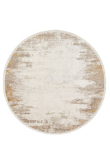 The Abstract Blitz Premium Rug - Gold - M658F is a round, machine-made piece with a distressed pattern in beige, cream, and light brown tones, offering a soft texture and a subtle blend of muted colors.