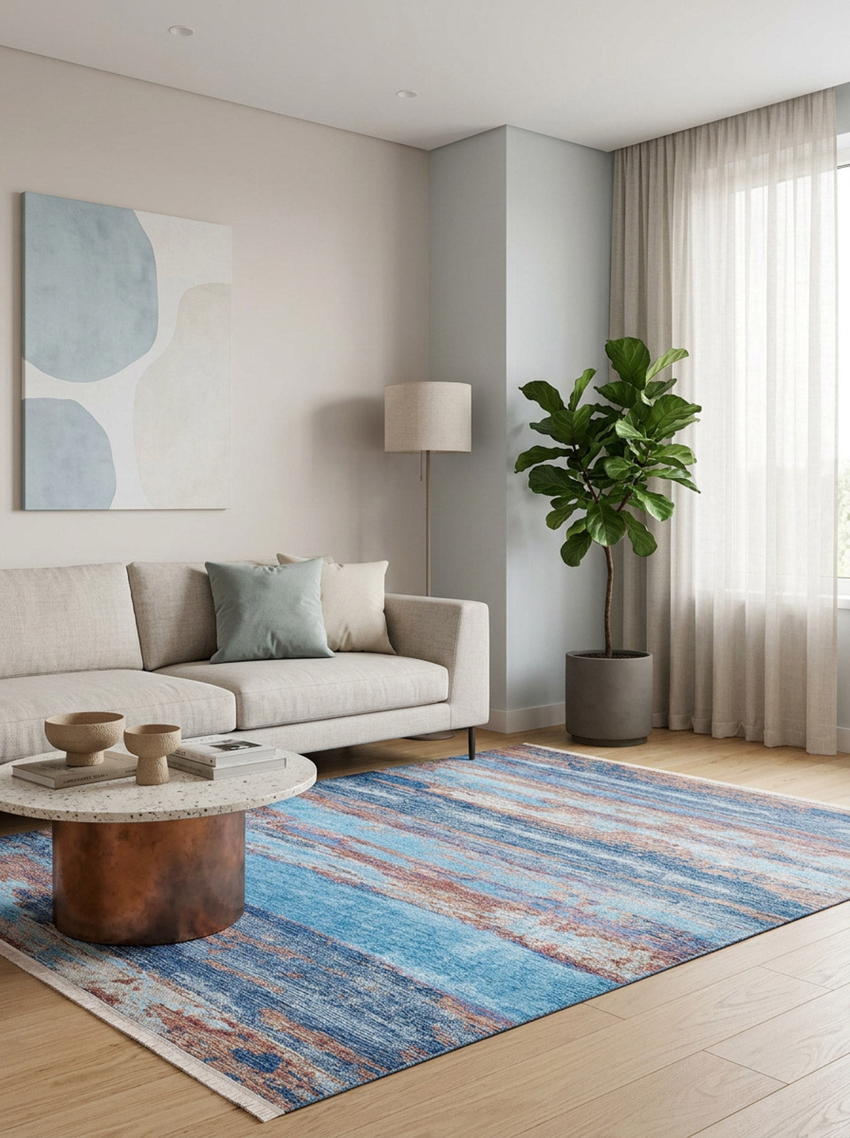 A modern living room with a beige sofa, blue and beige pillows, abstract wall art, round coffee table, tall plant, sheer-curtained windows, and the Abstract Elegance - Machine-Washable Rug JR87 (Custom Size) perfect for high-traffic areas.