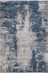 The Abstracta Blue Premium Rug - 1004F features a distressed abstract pattern in blue, gray, and beige tones with painterly brushstrokes for a modern, artistic look. Machine-made for durability and style.