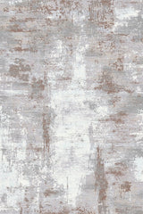 The Abstracta Creme Premium Rug - 1004B features a distressed, weathered look in gray, white, and brown tones with uneven patches and brush-like strokes—perfect for adding abstract style to any room.