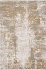 The Abstracta Gold Premium Rug - 1004G features a machine-made abstract design in beige, ivory, gray, and gold tones, with a distressed pattern for a weathered look. Blended colors and irregular shapes add textured visual appeal throughout.