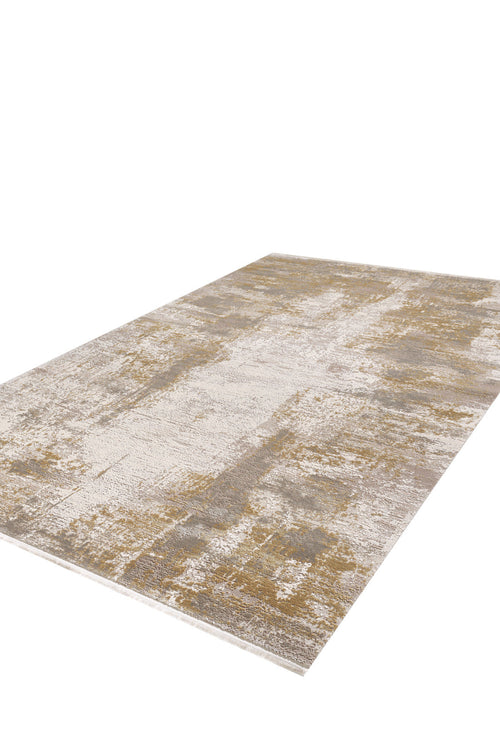 Load image 1 in gallery view. The Abstracta Gold Premium Rug - 1004G features a rectangular design with a distressed abstract pattern in beige, gold, and gray, shown on a white background.