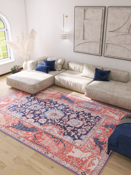 Load image 1 in gallery view. A bright living room with a large beige sectional, blue accent pillows, light wood floors, abstract wall art, and an Aegis Handmade-Design Washable Rug - LCC3029 (Custom Size) ideal for high-traffic areas beside a tall vase of pampas grass near a window.