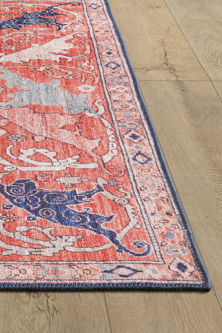 Aegis Handmade-Design Washable Rug - LCC3029 (Custom Size), featuring vibrant red, blue, and cream ornate patterns with a decorative border, sits on a light wood floor—ideal for high-traffic spaces.