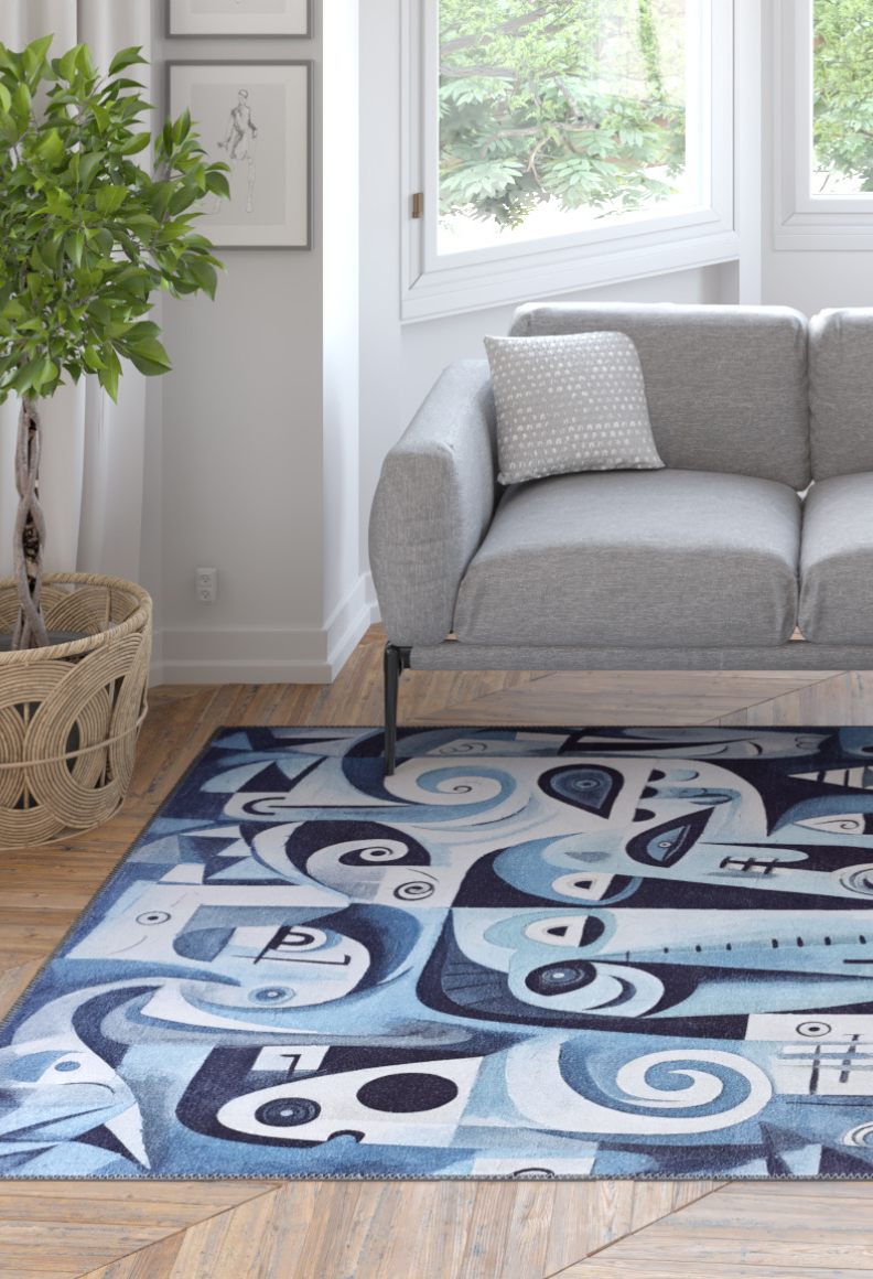 A modern living room with a light gray sofa, polka dot pillow, potted plant, light wood floors, abstract wall art, and the Aesthetic Anomaly Contemporary Washable Rug - MDJ004—a blue rug with stylized faces, ideal for high-traffic areas.