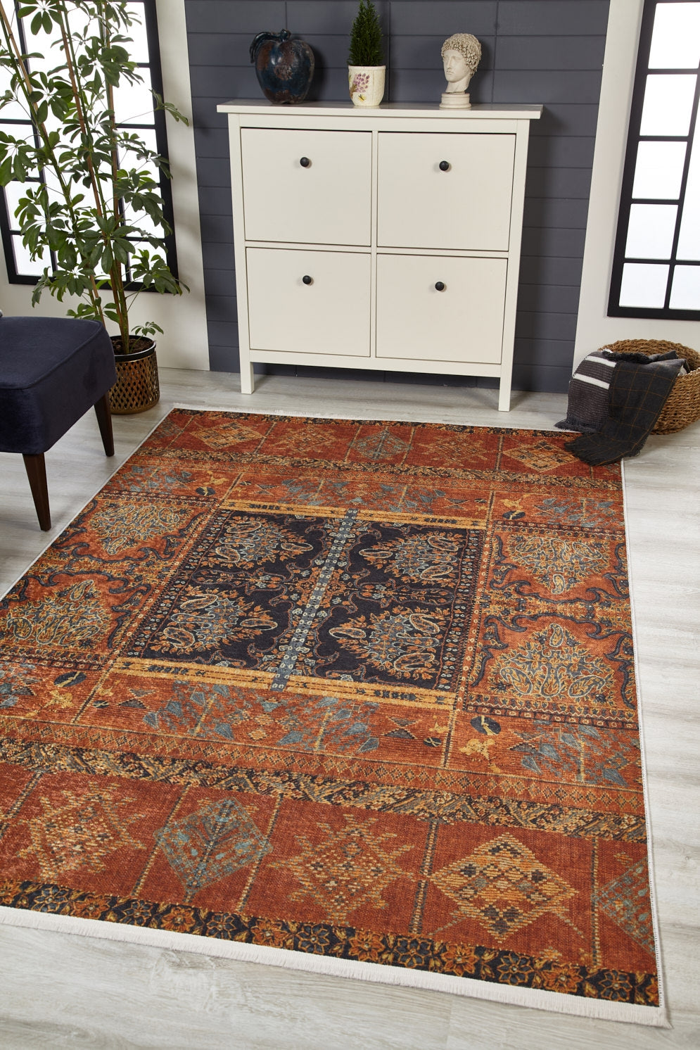 The Ancient Palace - Washable Rug - JR1864 (Custom Size) with vibrant red, blue, orange, and gold patterns adds color to a light wood floor by a white cabinet, making this modern room inviting and ideal for high-traffic areas.