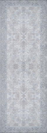 The Ancient Treasure - Washable Rug - JR1785 features a faded, intricate pattern in light gray, blue, and beige with a symmetrical design and ornate dark border—washable and perfect for high-traffic areas.