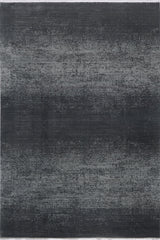 The Antrachite Shadows Black Rug - M497A is a modern rectangular area rug with a dark gray and black gradient, featuring subtle horizontal lines and a slightly distressed, textured pattern.