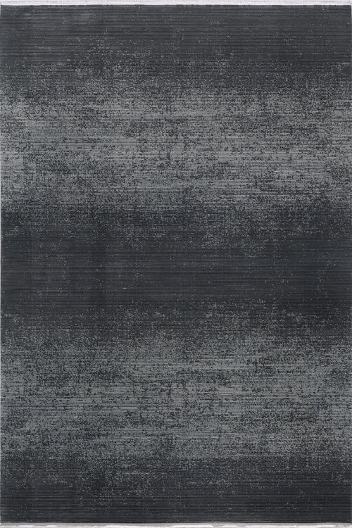 Load image 1 in gallery view. The Antrachite Shadows Black Rug - M497A is a modern rectangular area rug with a dark gray and black gradient, featuring subtle horizontal lines and a slightly distressed, textured pattern.