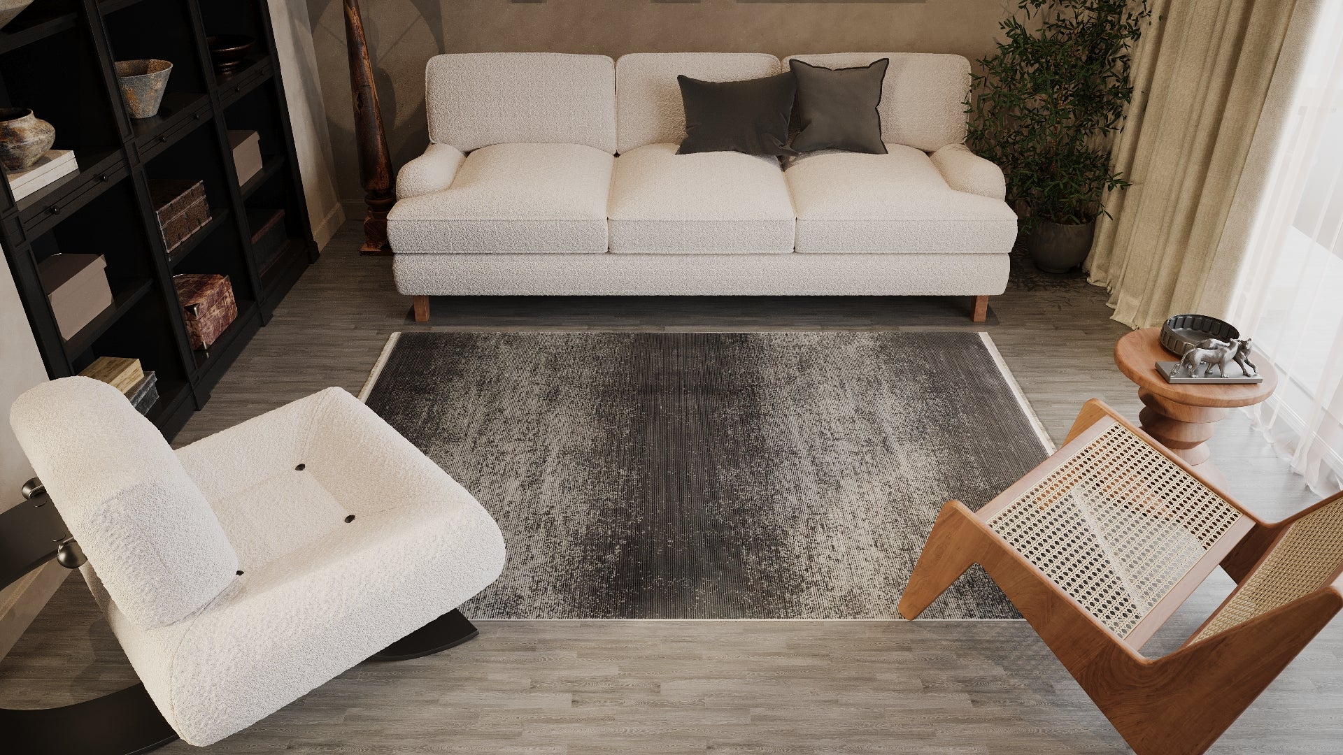 A modern living room with a white sofa, gray pillows, white armchair, wooden chair, bookshelves, plant, and round side table is anchored by the stylish Antrachite Shadows Black Rug - M497A.