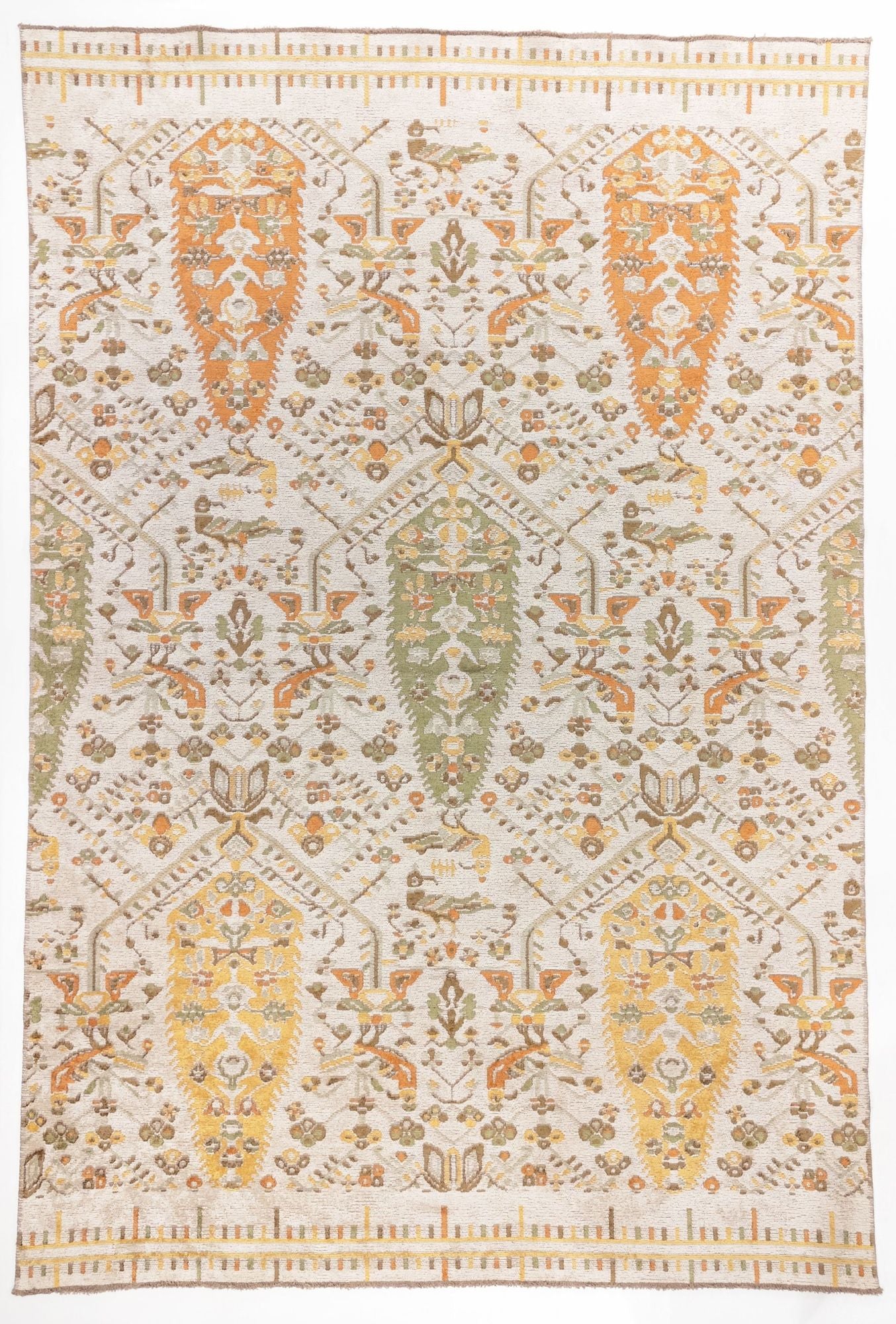 
Saffron Heritage area rug with cream ground and orange, gold, and sage green paisley boteh motifs