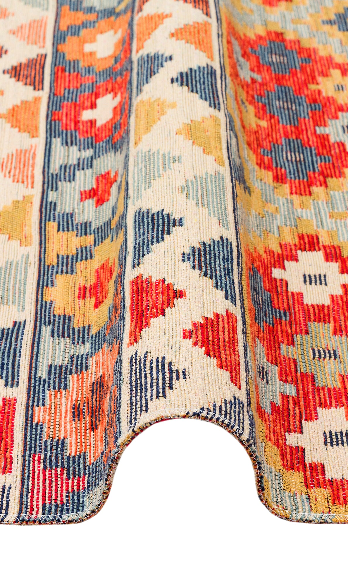 The Aqua Flow - Kilim - NMD02 is a colorful flatwoven polyester rug with geometric red, blue, yellow, and cream patterns, featuring a wavy bottom edge and distinct vertical stripes with diamond and floral shapes.