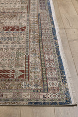 A detailed view of the Archery Elegance Premium Rug - Earthy - 2183B, a machine-made piece with intricate geometric and floral patterns in red, blue, green, and beige, plus decorative borders, placed on a light wood floor.