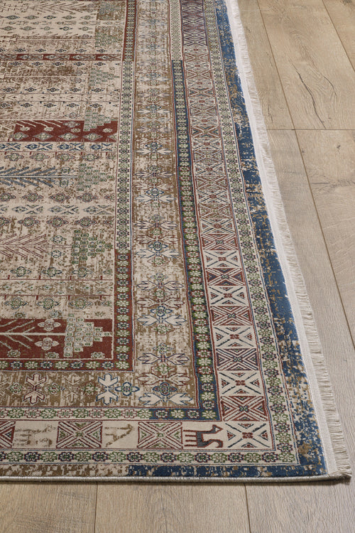 Bild 1 in Galerieansicht laden. A detailed view of the Archery Elegance Premium Rug - Earthy - 2183B, a machine-made piece with intricate geometric and floral patterns in red, blue, green, and beige, plus decorative borders, placed on a light wood floor.