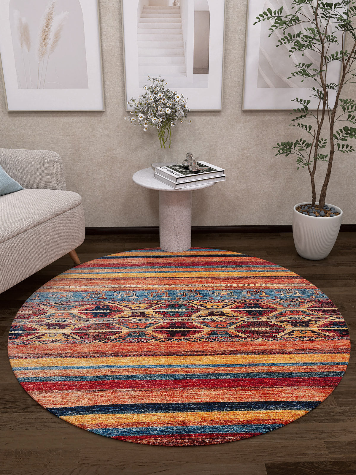 The Arctic Chill - Washable Rug - JR860 features vibrant stripes and geometric designs, brightening any living room or high-traffic area. Nearby are a small table with flowers, a potted plant, part of a sofa, and framed art on a beige wall.