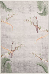 The Ashwing Silence - Washable Rug (JR0048) features two gray parrots with pink faces on flowering branches, green palm leaves, and orange floral vines in the corners. Its light-colored background has a subtle, textured look.