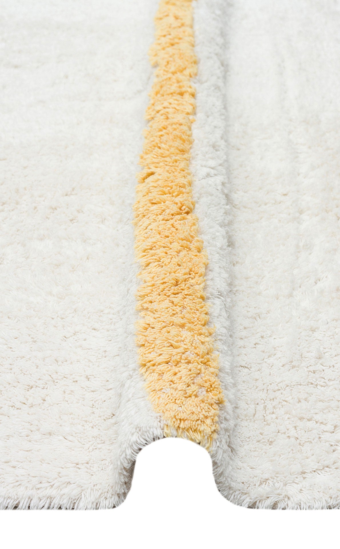 The Baby Breeze - Washable Shaggy - CBN01 is a white, fluffy rug with a raised yellow stripe and U-shaped notch—washable and perfect for adding playful style to any kids room.