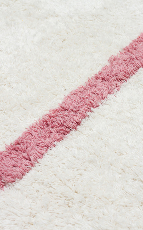 Load image 1 in gallery view. The Baby Breeze - Washable Shaggy - CBN01 is a white, fluffy, washable rug with a bold diagonal pink stripe—ideal as a cozy kids' room or nursery rug.