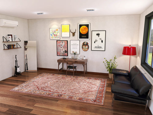 Load image 1 in gallery view. A modern living room with a black sofa, red lamp, and the Baroque Charm - Washable Rug - JRN1016 (Custom Size). A wooden desk holds art supplies; artworks, posters, shelves, guitars, and a plant decorate the space. Natural light streams through a large window.