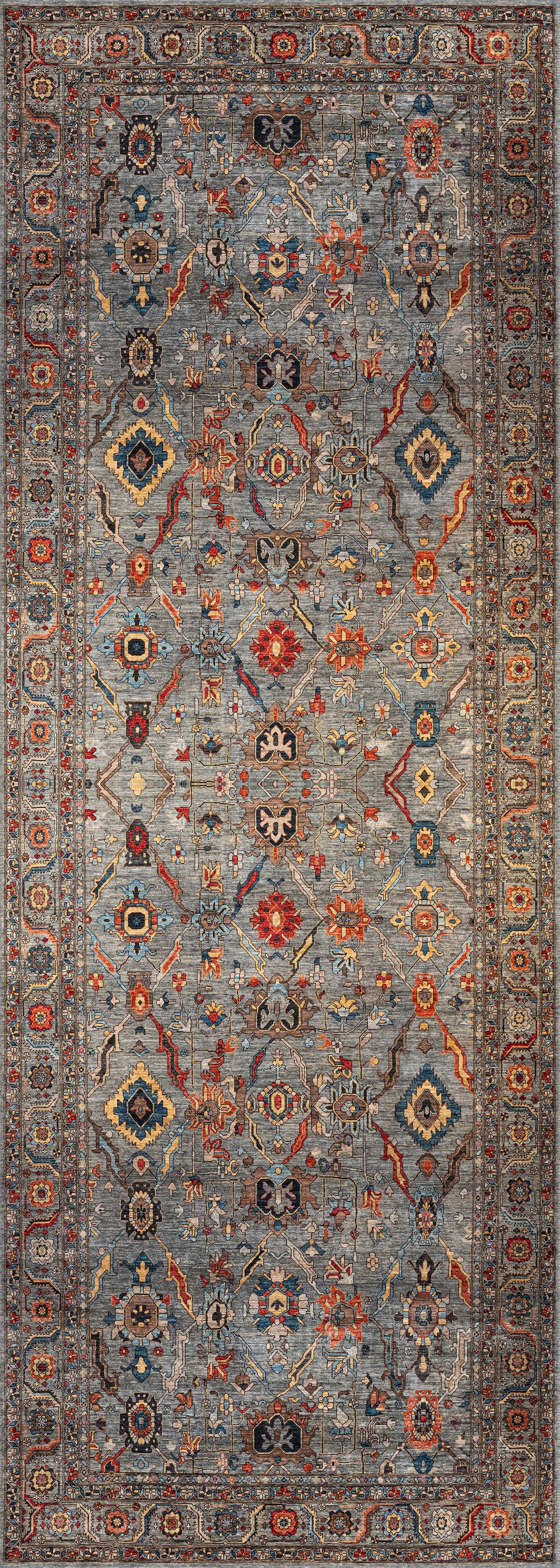The Bellaris Gray Washable Rug - LCC3003 is a rectangular rug with an intricate geometric and floral pattern in blue, red, gold, and cream, detailed border, symmetrical design, and ideal for allergy-sensitive spaces.