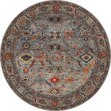 The Bellaris Gray Washable Rug - LCC3003 features a round shape and a detailed geometric and floral pattern in blue, red, gold, and beige with a decorative border—perfect for allergy-sensitive or high-traffic areas.