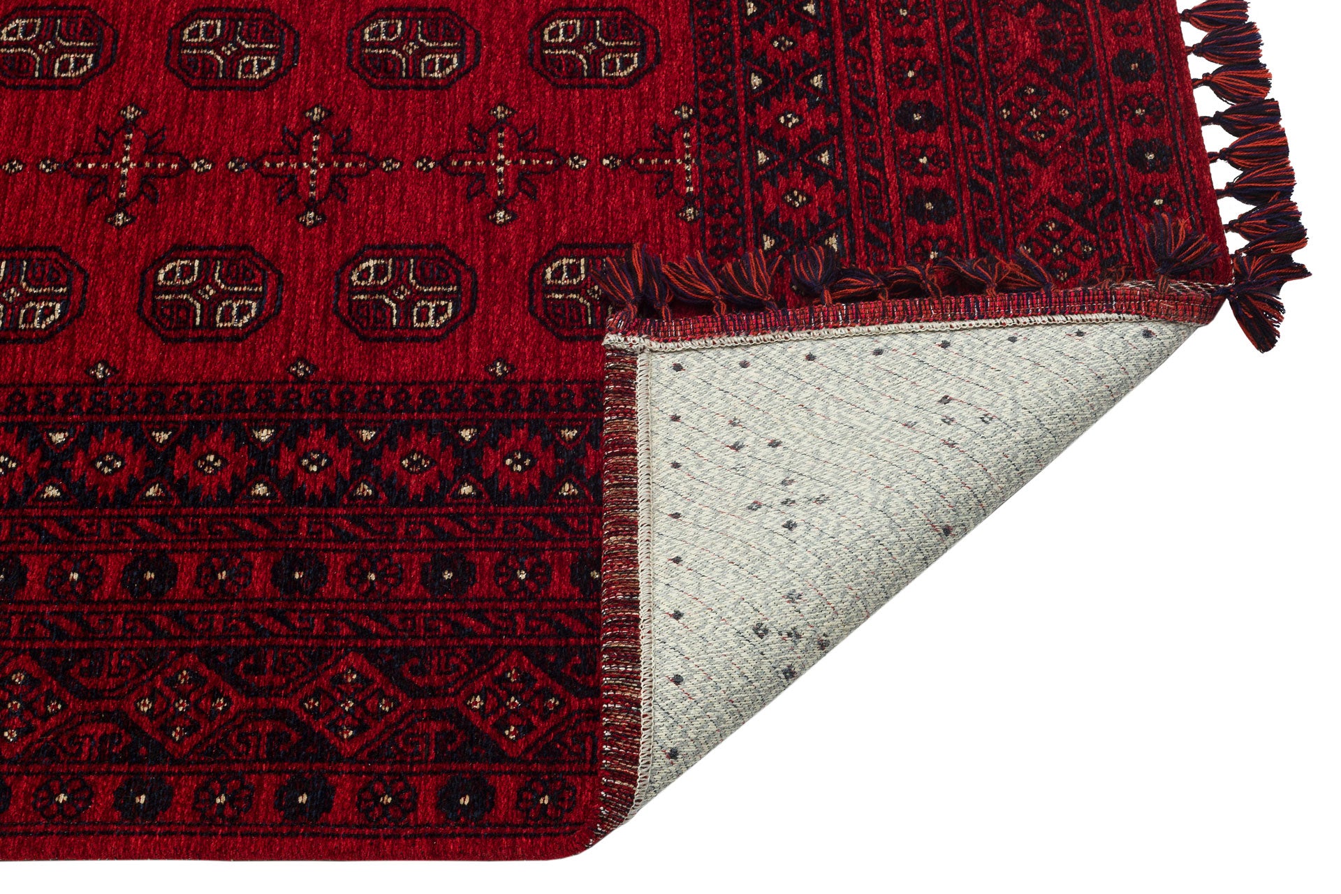 The Berry Pattern - Kilim - BHR04 is a red Turkish chenille-polyester rug with black and white geometric designs, fringed edges on one side, and a partially folded corner showing its light gray, speckled underside.