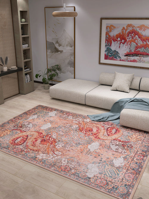 Load image 1 in gallery view. A modern living room with a light sectional, the Blazefang Myth - Washable Rug - JR0049 featuring a vibrant red and orange dragon, beige flat weave, wall art of colorful mountains, potted plants, and wooden decor shelves.